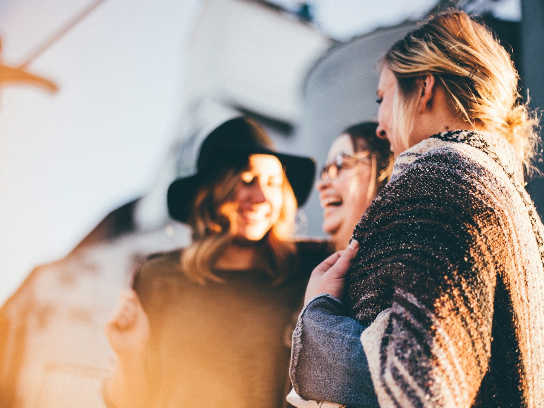 Women travellers laughing together on a women-only group trip with a local host