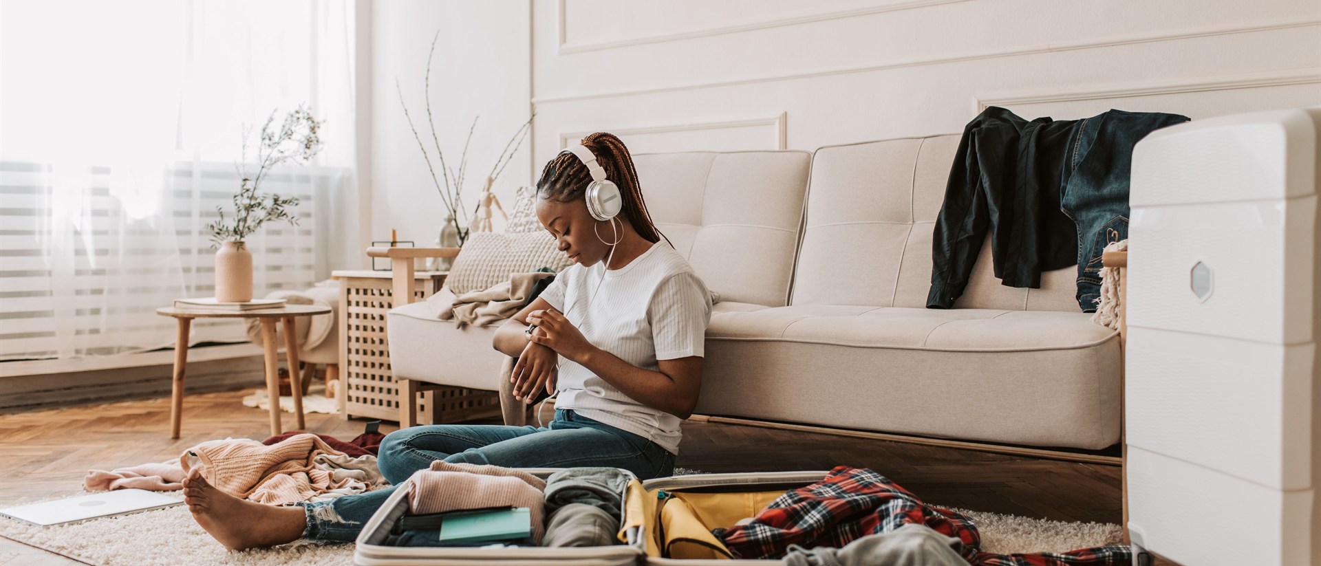 woman packing suitcase for solo travel